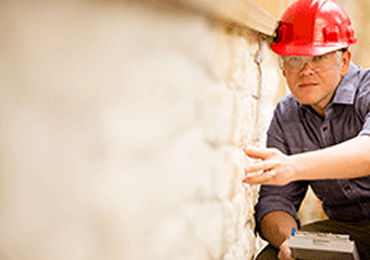 inspecting a foundation repair in Auburn